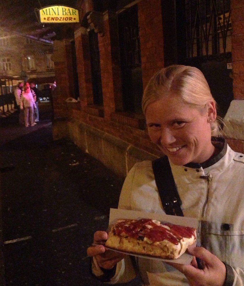 Enjoying the traditional snack zapiekanka.