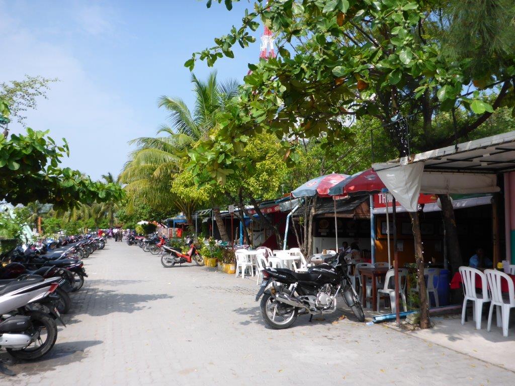 A row of restaurants by the commercial harbour.