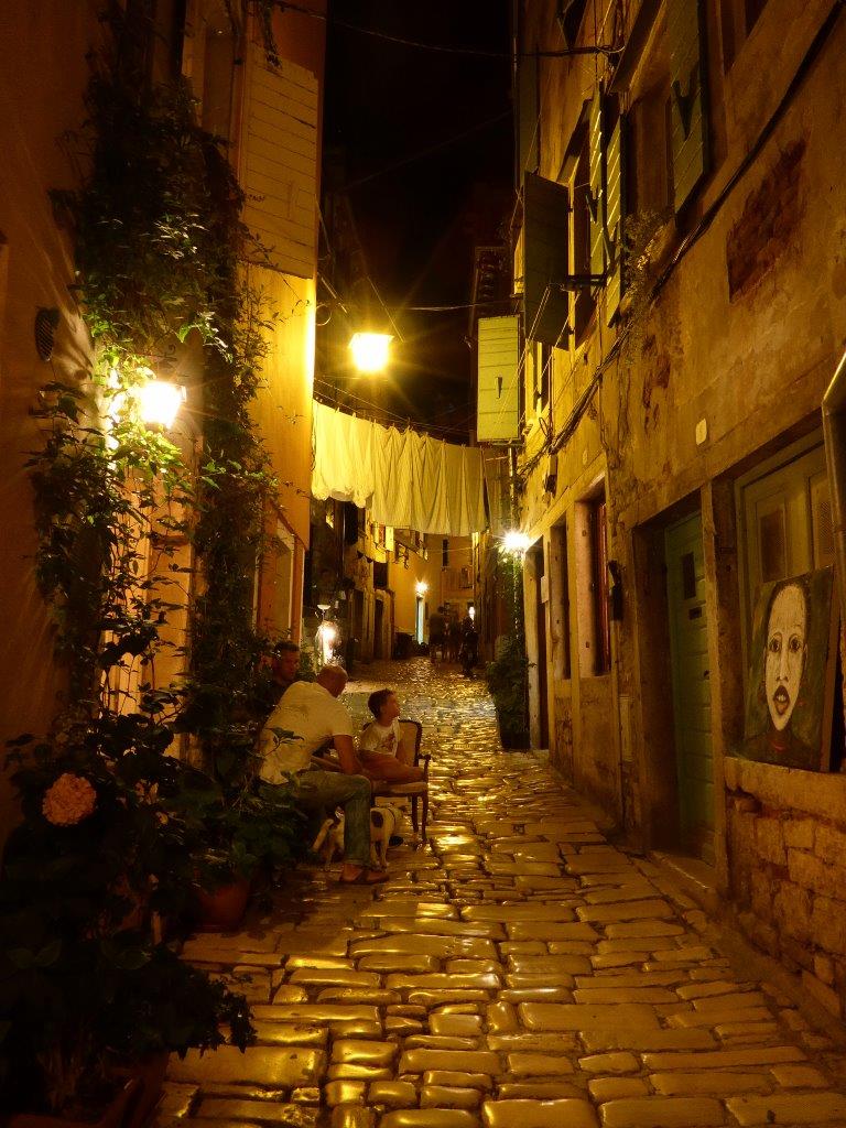 Locals hanging out in the old town of Rovinj, Croatia