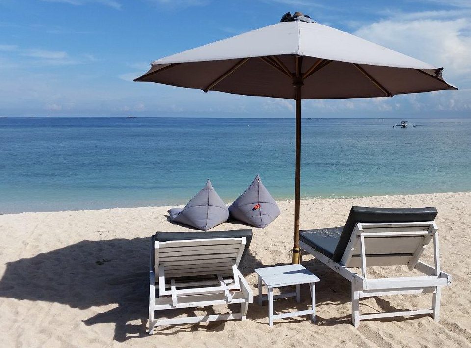 Relaxing beach life. Sunset Beach Bungalows. Gili Meno island, Indonesia
