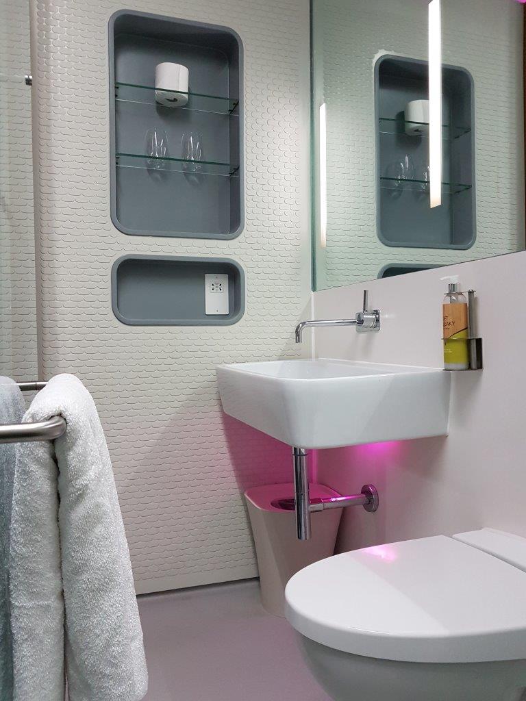 The bathroom in a Premium cabin at YOTELAIR at Amsterdam Airport Schiphol. There is also a monsoon rain shower.
