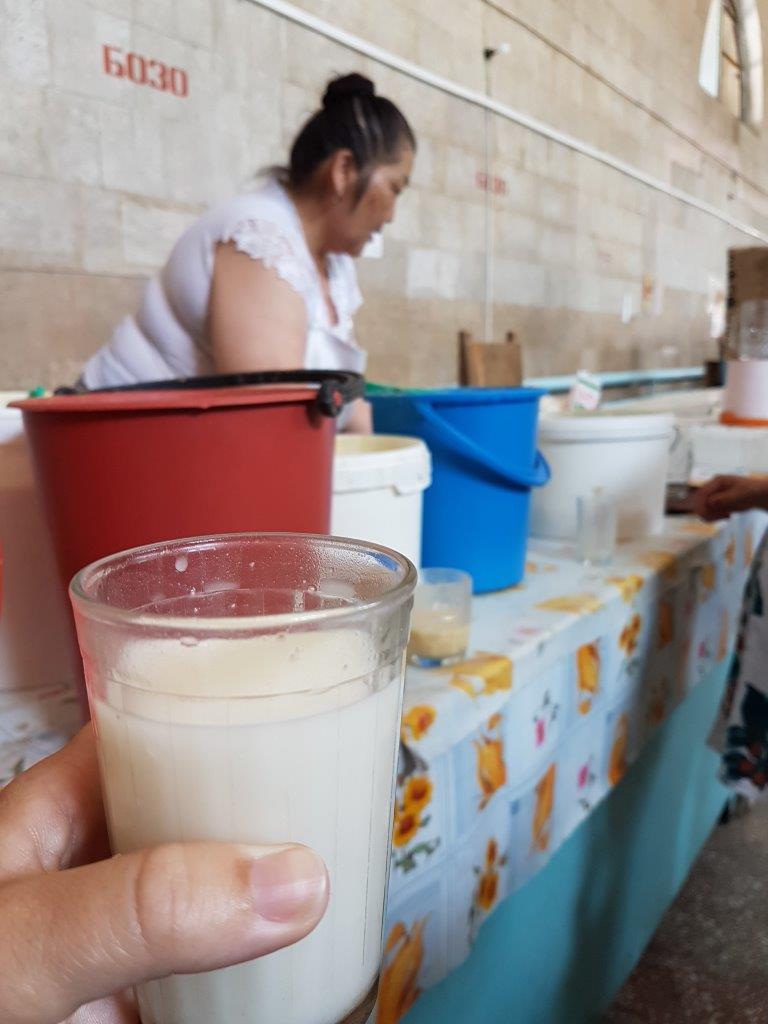 Kumis - fermented mare's milk. Osh Bazaar. Food tour in Bishkek, Kyrgyzstan