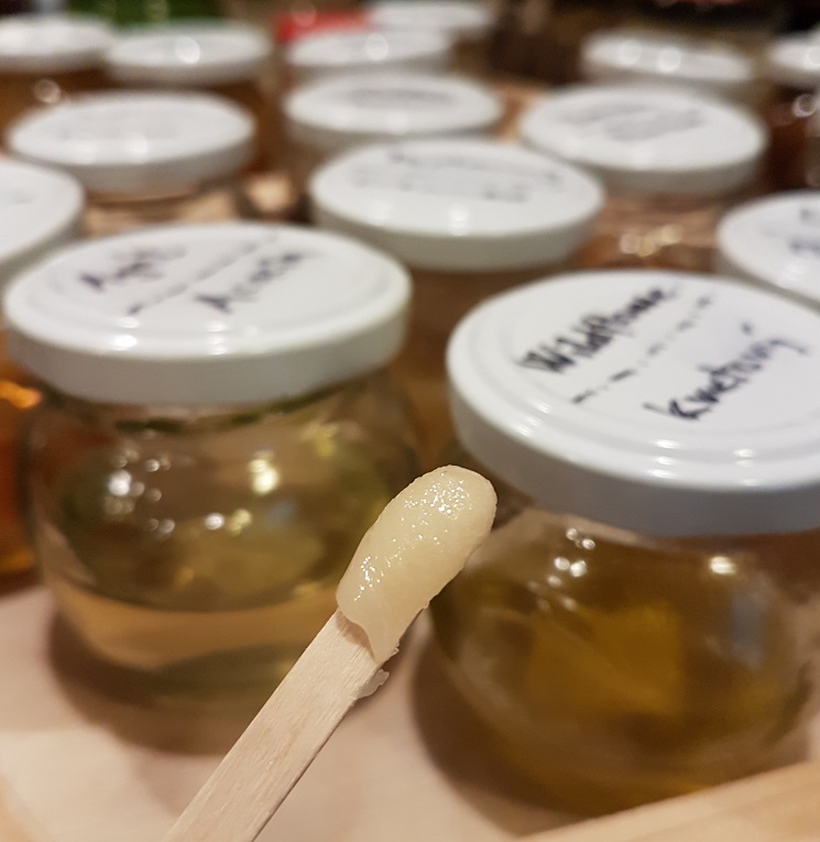 Different types of flavoured honey. Food tour in Bratislava, Slovakia.